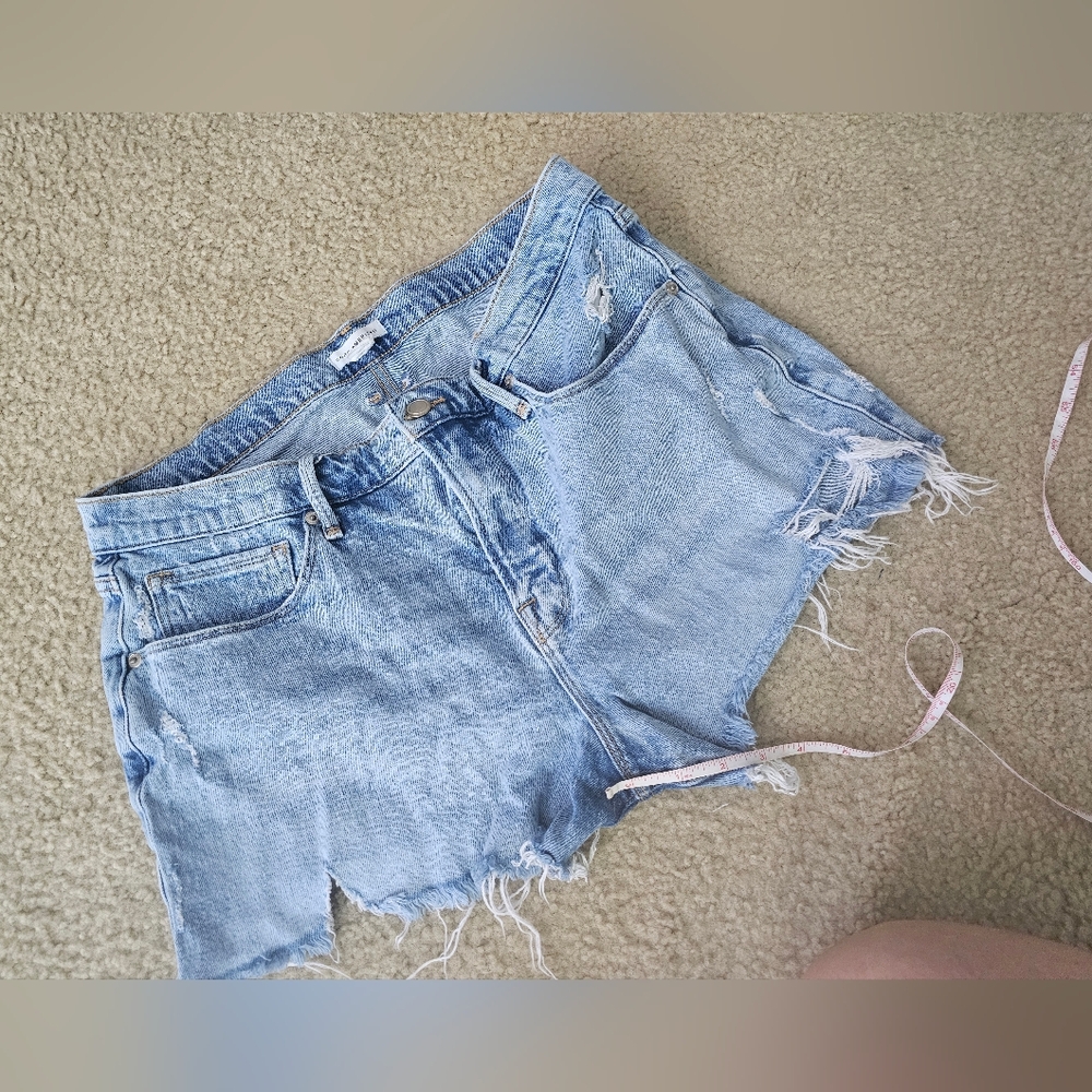 Good American Distressed Light Denim Shorts